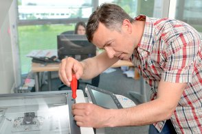 handyman fixing the office printer