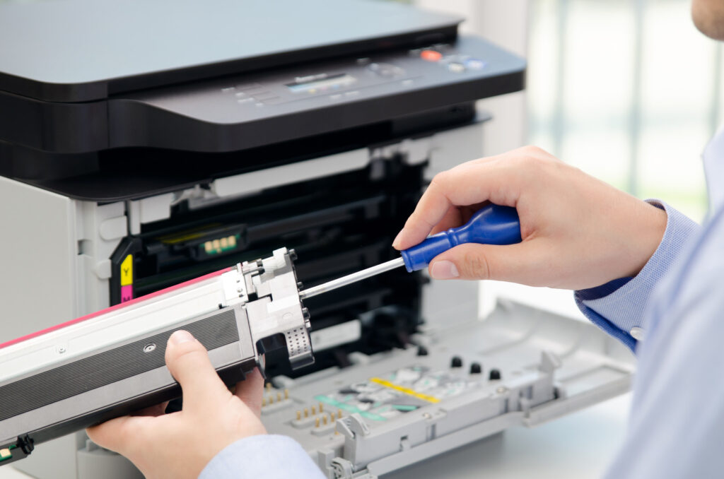 Man repairing printer