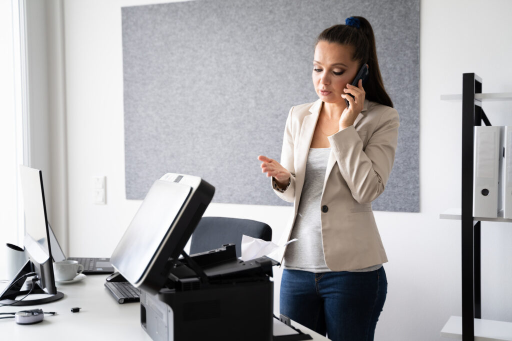 Printer Repairs team member on call with client